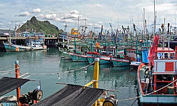 'Fisherboats at the Pier of Prachuap Khiri Khan' by Asienreisender